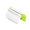 1 Pc Rolling Tube Toothpaste Squeezer Toothpaste Seat Holder Stand Rotate Toothpaste Dispenser for Bathroom ATHLEXES