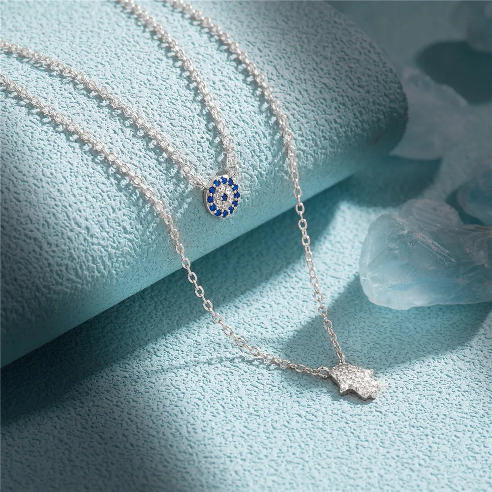 CANNER 925 Silver Devil Eyes Blue Zircon Pendant Necklace ATHLEXES