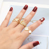 OCESRIO Mini Crystal Flower Open Ring in Gold Plated Copper ATHLEXES