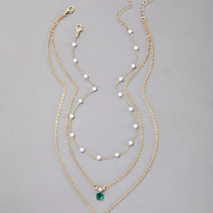 Emerald Elegance Layered Pearl Necklace ATHLEXES